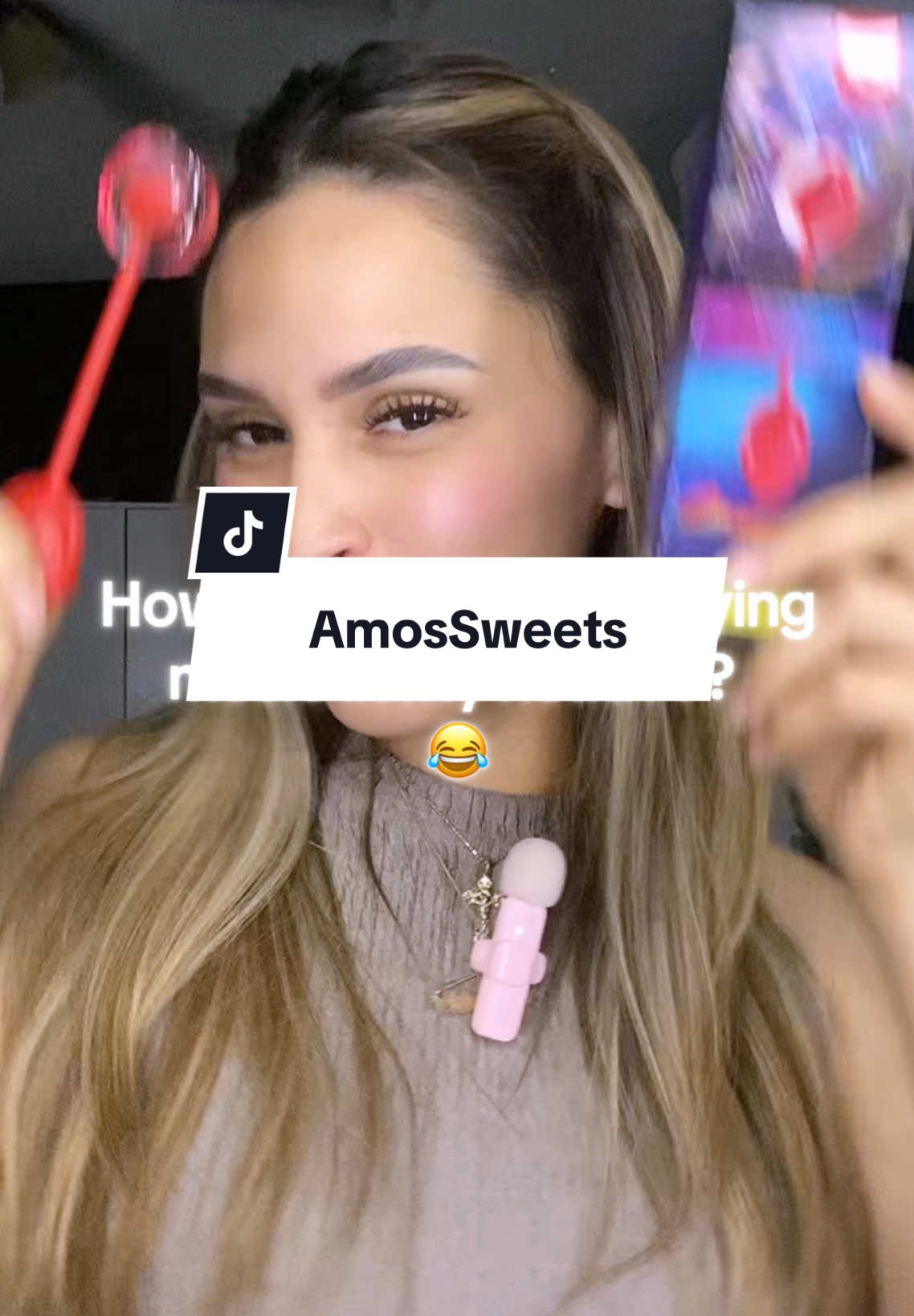 TikTok post by @kayycm for Amos Sweets. Caption reads: Viral Audio Lollipop from @Amos Sweets 🍭 I’ll....