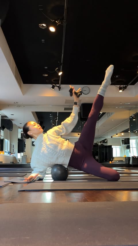 Instagram post by @paveekwun for TAVI. Caption reads: FULL BODY PILATES BURN 🔥 home for the holidays....