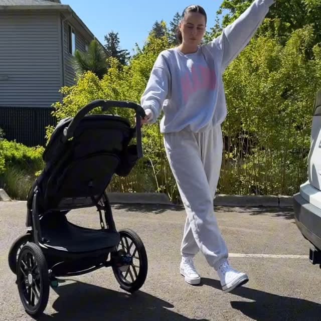 Instagram post by @kristinakking for UPPAbaby. Caption reads: your sign to do a color walk! 🌺🌸🌳✨ obsessed....