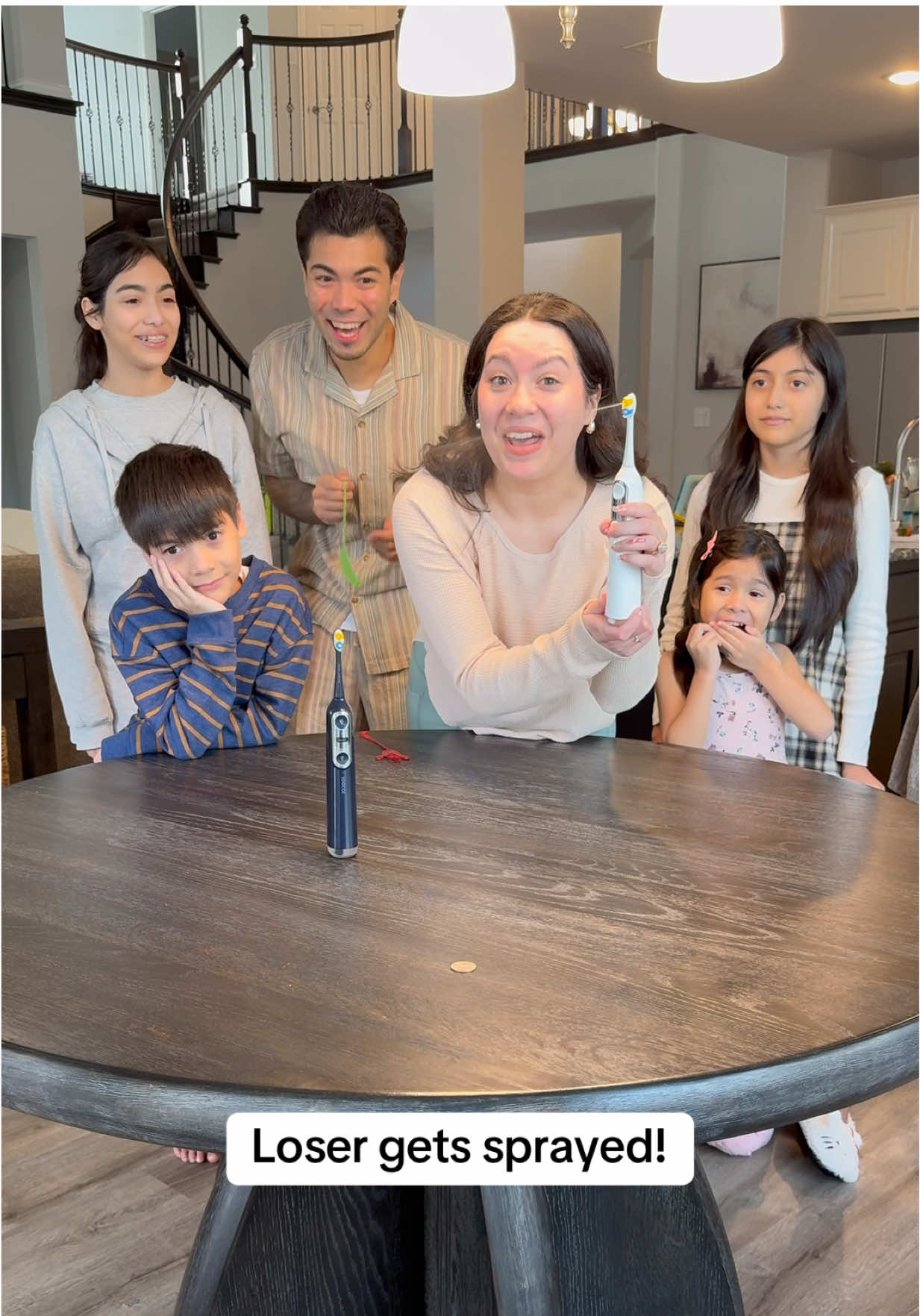 TikTok post by @himandherofficial for Soocas Taiwan. Caption reads: We really did NOT want to get sprayed! 🤣 @Soocas....