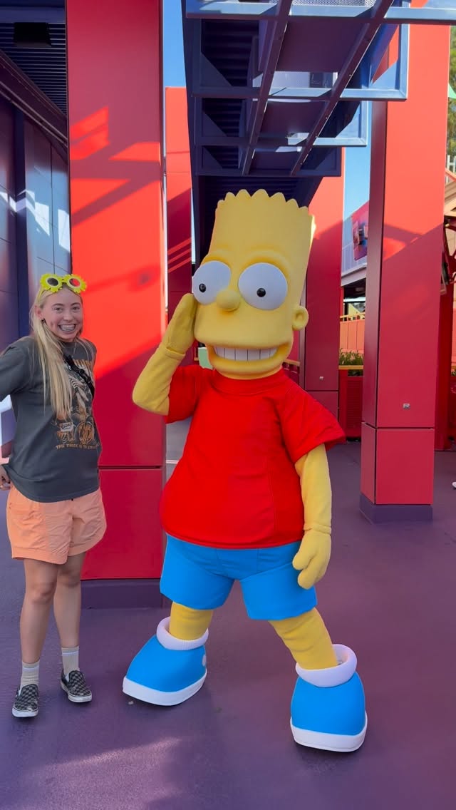 Instagram post by @wisewordsfromneve for Universal Studios Hollywood. Caption reads: Awkward… #wisewordsfromneve #bart #simpsons....