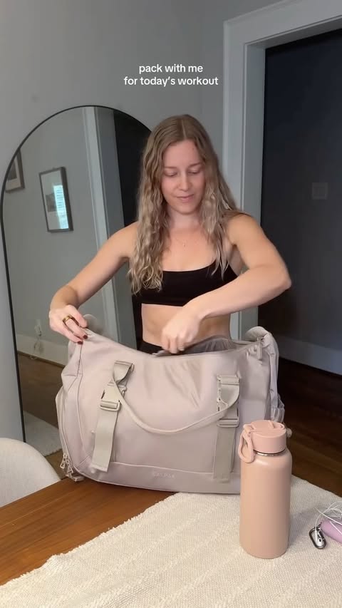 Instagram post by @cambwoods for CALPAK. Caption reads: let's go to the gym together using my @calpak gym....