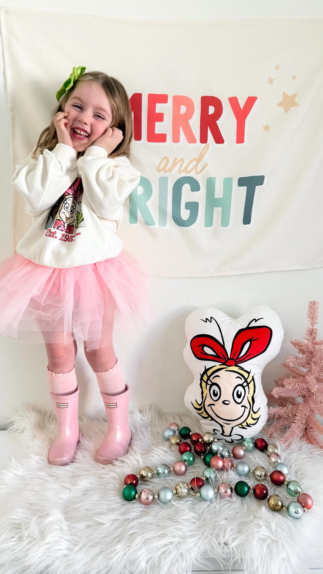 Instagram post by @felt_sew_loved for iloveplum. Caption reads: Merry Grinchmas💚🎀
Wren is in her whoville era....