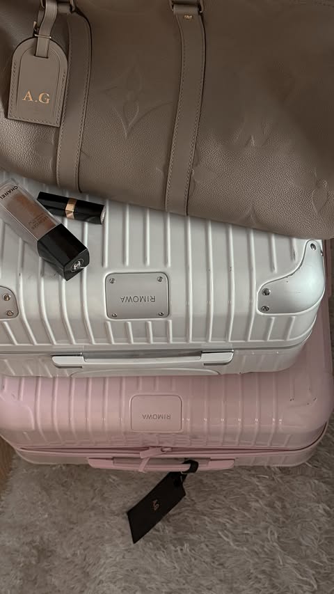 Instagram post by @gubachevaanastasia for RIMOWA. Caption reads: Check-in is now open.
Outfit: costume....