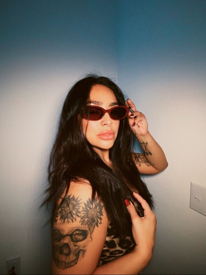 Instagram post by @ciierahh for Firmoo. Caption reads: Your sign to have your own little photo shoot....