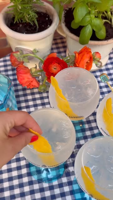 Instagram post by @justines.table for Bombay Sapphire. Caption reads: Summer snacks paired with the @bombaysapphireus....