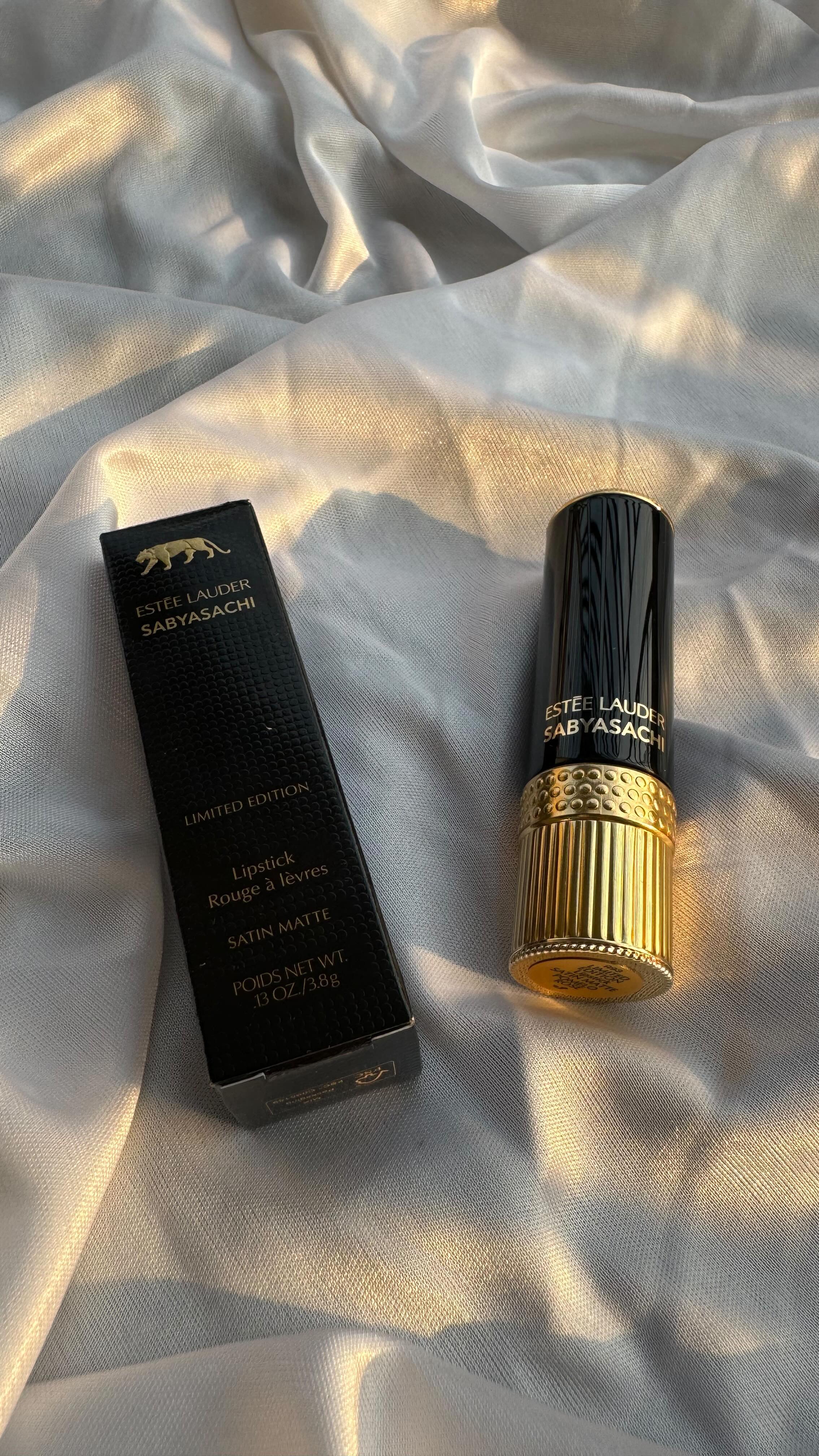 Instagram post by @ayushmita09 for Sabyasachi. Caption reads: [...] lipstick Collection by @esteelauder X....