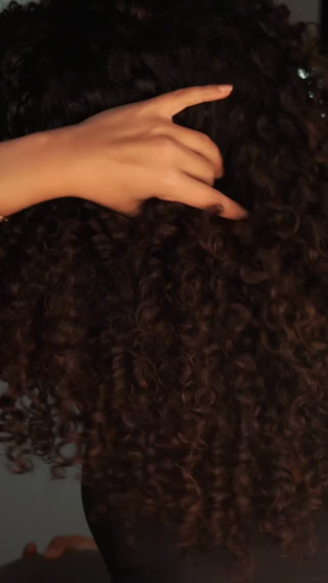 Instagram post by @moon.azad for FENTY HAIR. Caption reads: [...] bouncy & defined curls will always be....