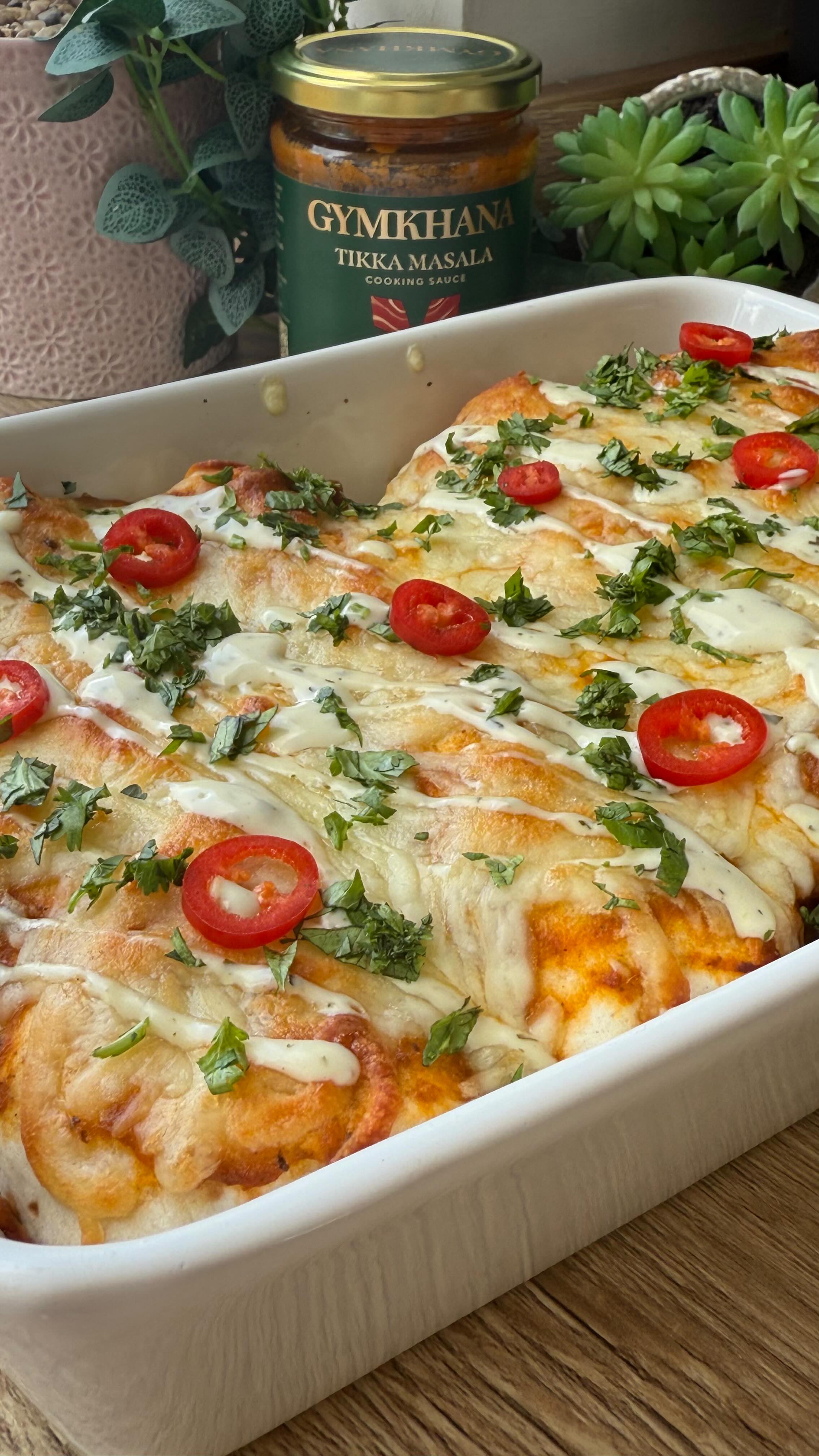 Instagram post by @dinner_at_hols for Gymkhana Fine Foods. Caption reads: Tikka Chicken Enchiladas

⬇️ Recipe below ⬇️

Ad|....