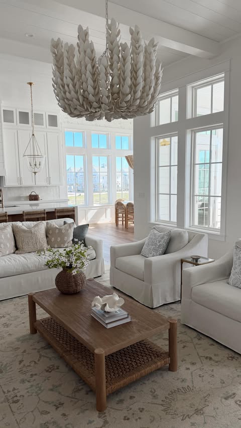 Instagram post by @emilyannetravis for Pottery Barn. Caption reads: My dream living room from @potterybarn 🐚 The York....