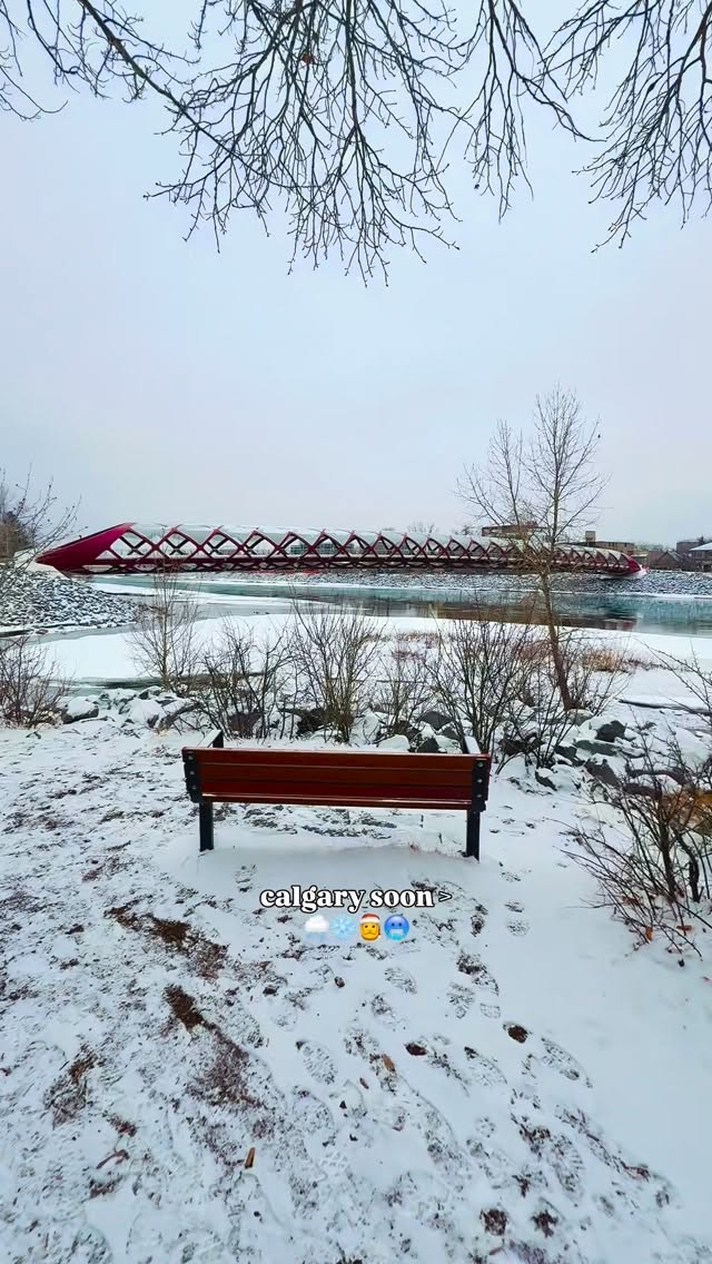 Instagram post by @thakralphotography for Travel Alberta. Caption reads: Winter is already here in Calgary! 🥶🌨️

This is....