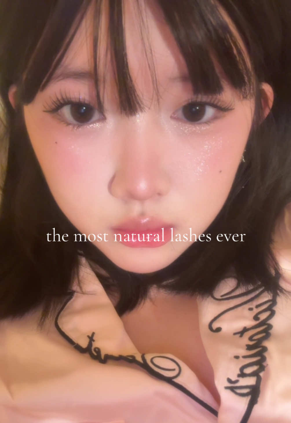 TikTok post by @elainesarchive for Ninetynine Dreams. Caption reads: my favorite lashes from @NinetynineDreams....