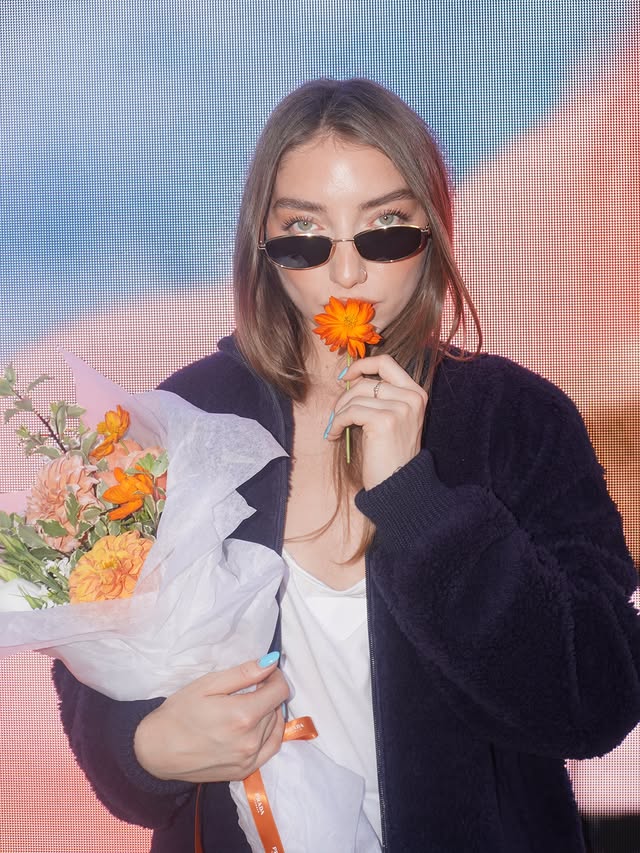 Instagram post by @zoifish for Prada. Caption reads: 🧡🧡🧡🧡 check out the @prada pop up at the grove....