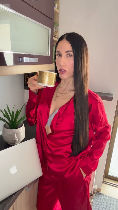 Instagram post by @despoinatss for Hunkemöller. Caption reads: Not just pyjamas.. a whole mood✨ Red satin, made....