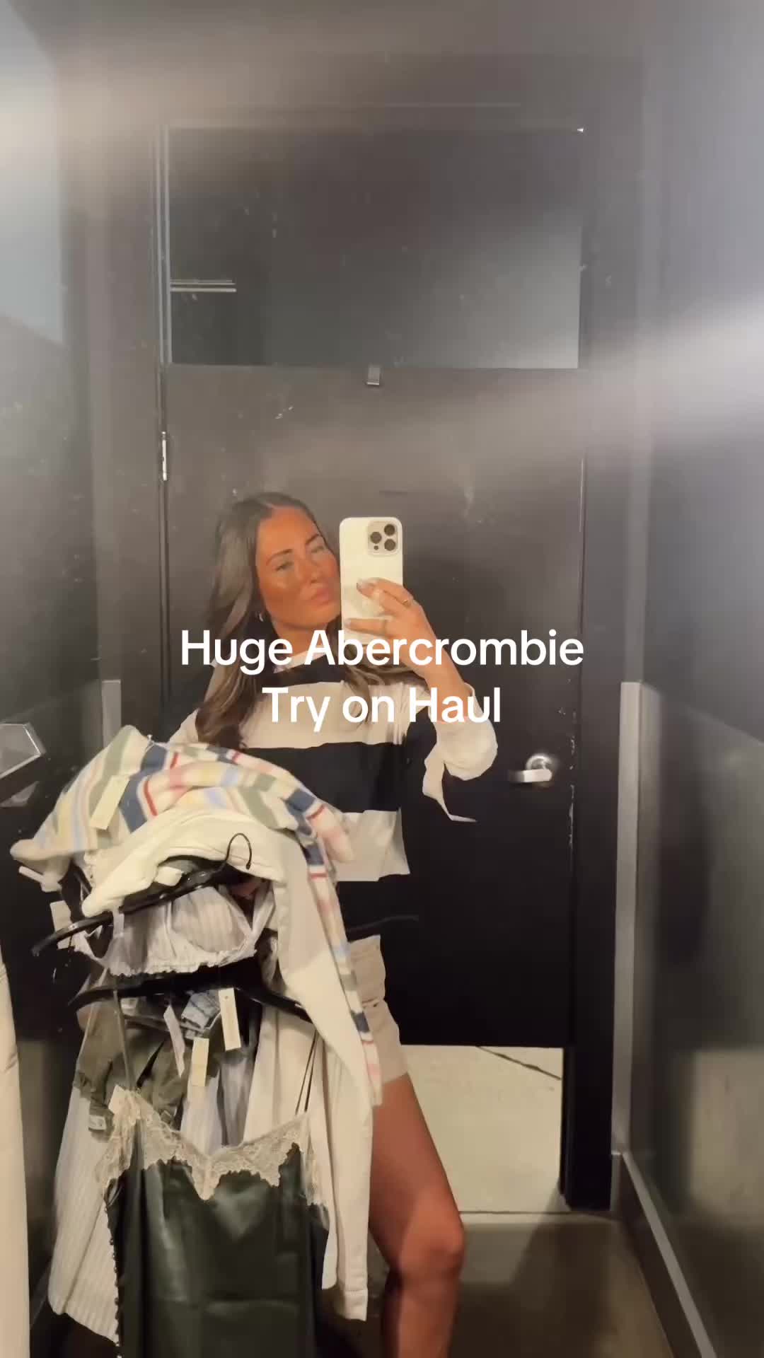 TikTok post by @cassandrajosteele for Abercrombie & Fitch. Caption reads: Huge @abercrombie try on haul! First sweater is....