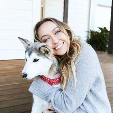 Instagram post by @brandicyrus for SmileDirectClub. Caption reads: This puppy knows how to put the BIGGEST smile on....