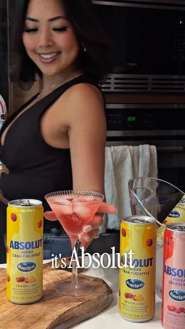Instagram post by @sincerelyreneze for Absolut. Caption reads: [...] hosting but you’re NOT cooking 😅🍒....