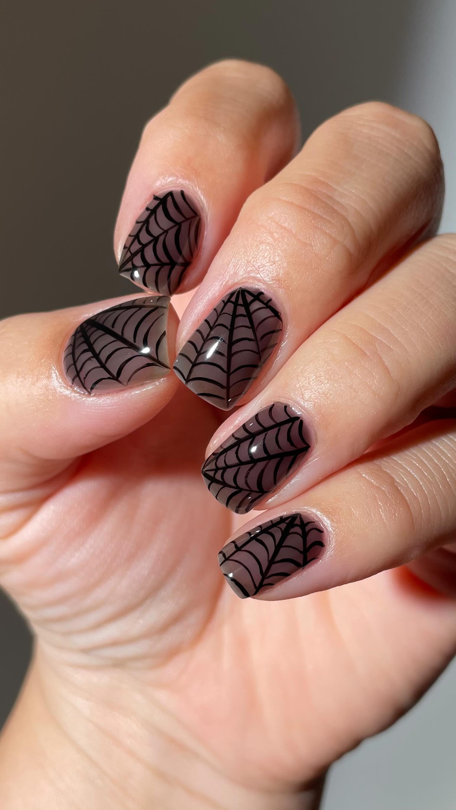 Instagram post by @ellzabethm for Cirque Colors. Caption reads: Spooky nail season 🖤🕷️🕸️ @cirquecolors Momento....