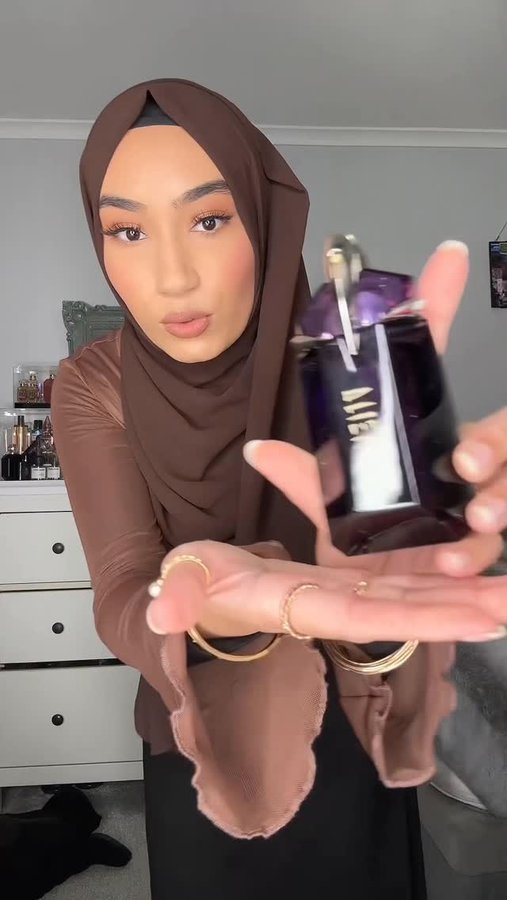 Instagram post by @mynameisrifah for Mugler. Caption reads: add some final touches with me 🤍

#dinner....