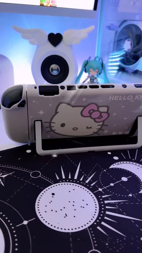 Instagram post by @mochiflurry for Geekshare. Caption reads: [...] is this Hello Kitty Switch 2 case from....
