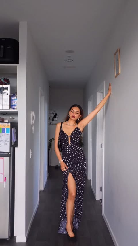 Instagram post by @khushivee for Mew Mews. Caption reads: POV: swimming with this dress @mewmewsofficial 🖤✨....