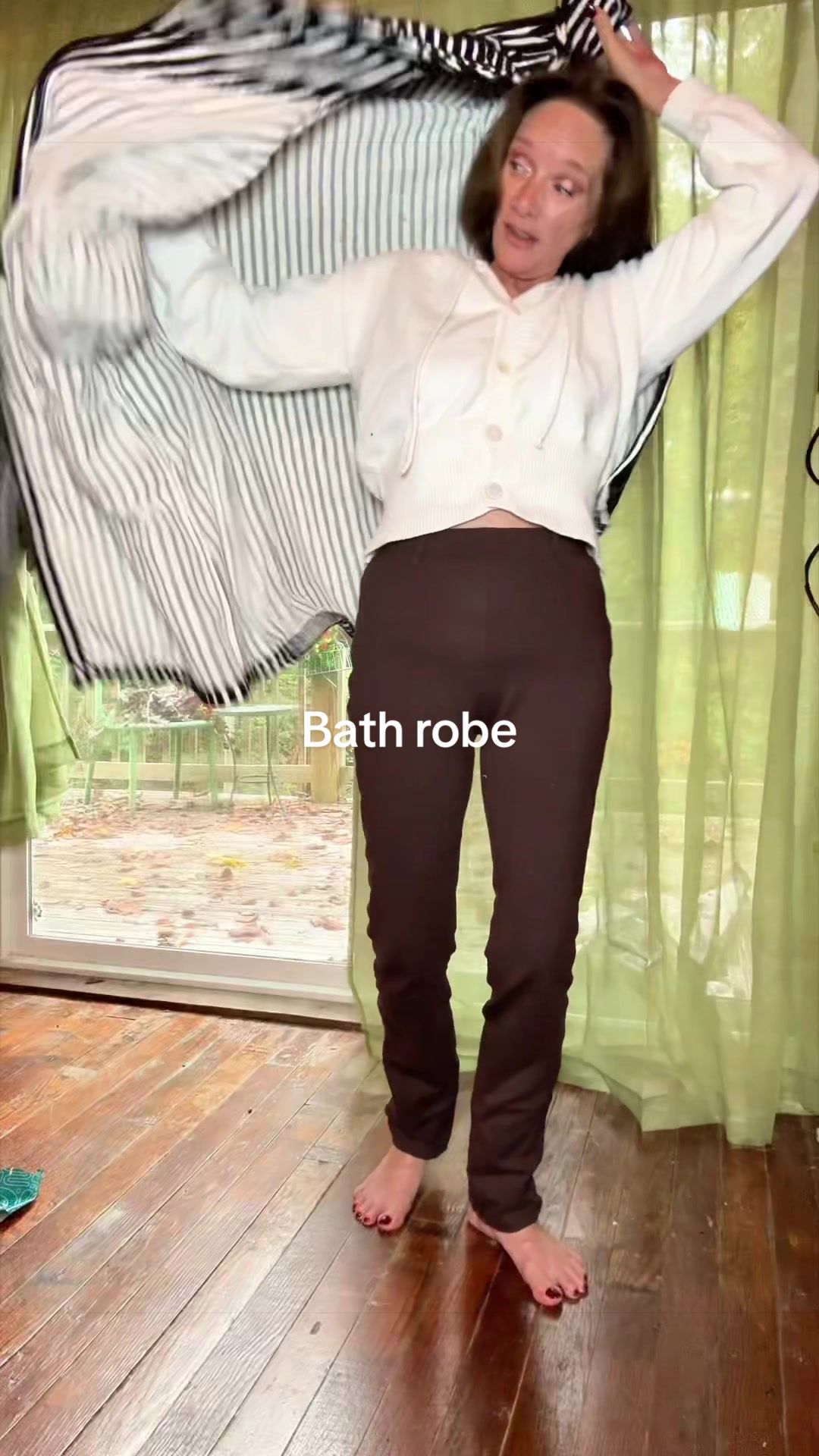 TikTok post by @kristine_over50beauty for Sand Cloud. Caption reads: @Sand Cloud #sandcloud #cottonrobe #robe #bathrobe....