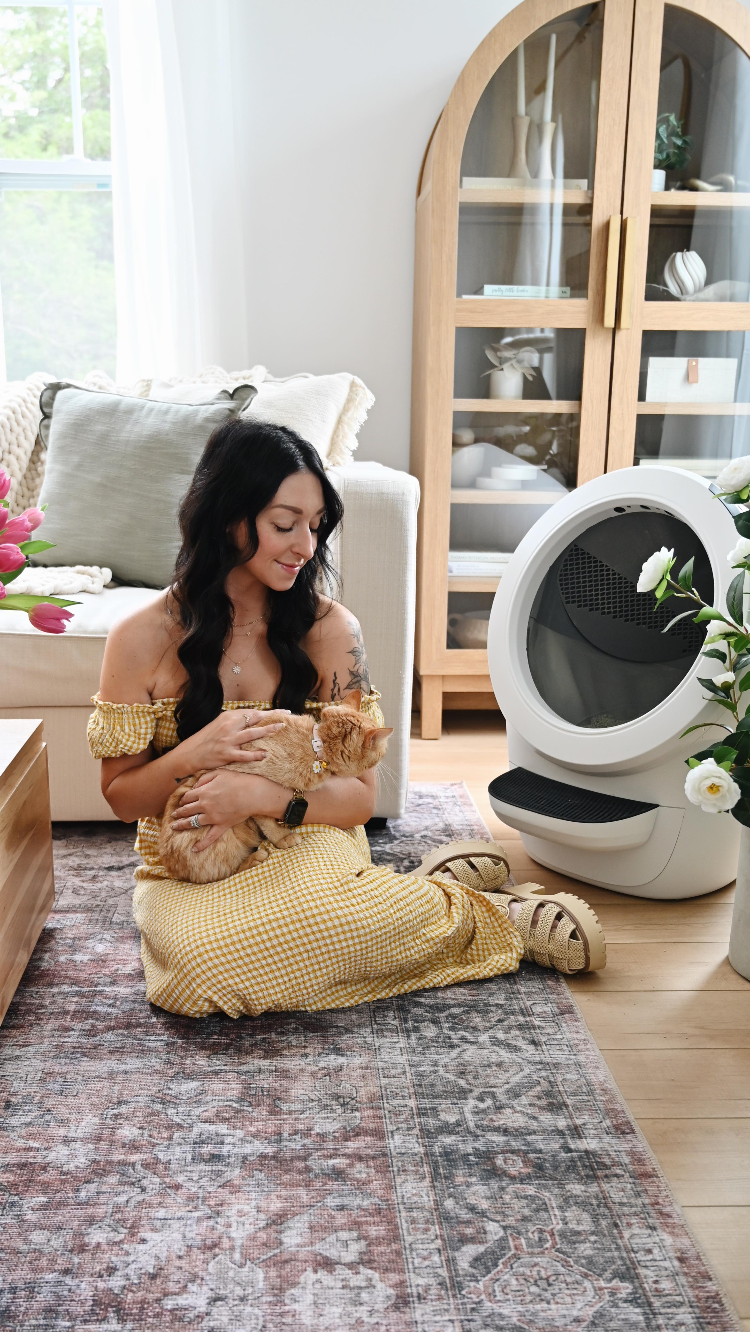 Instagram post by @emilywondree for Litter-Robot. Caption reads: Cat moms, you deserve a break from the daily....