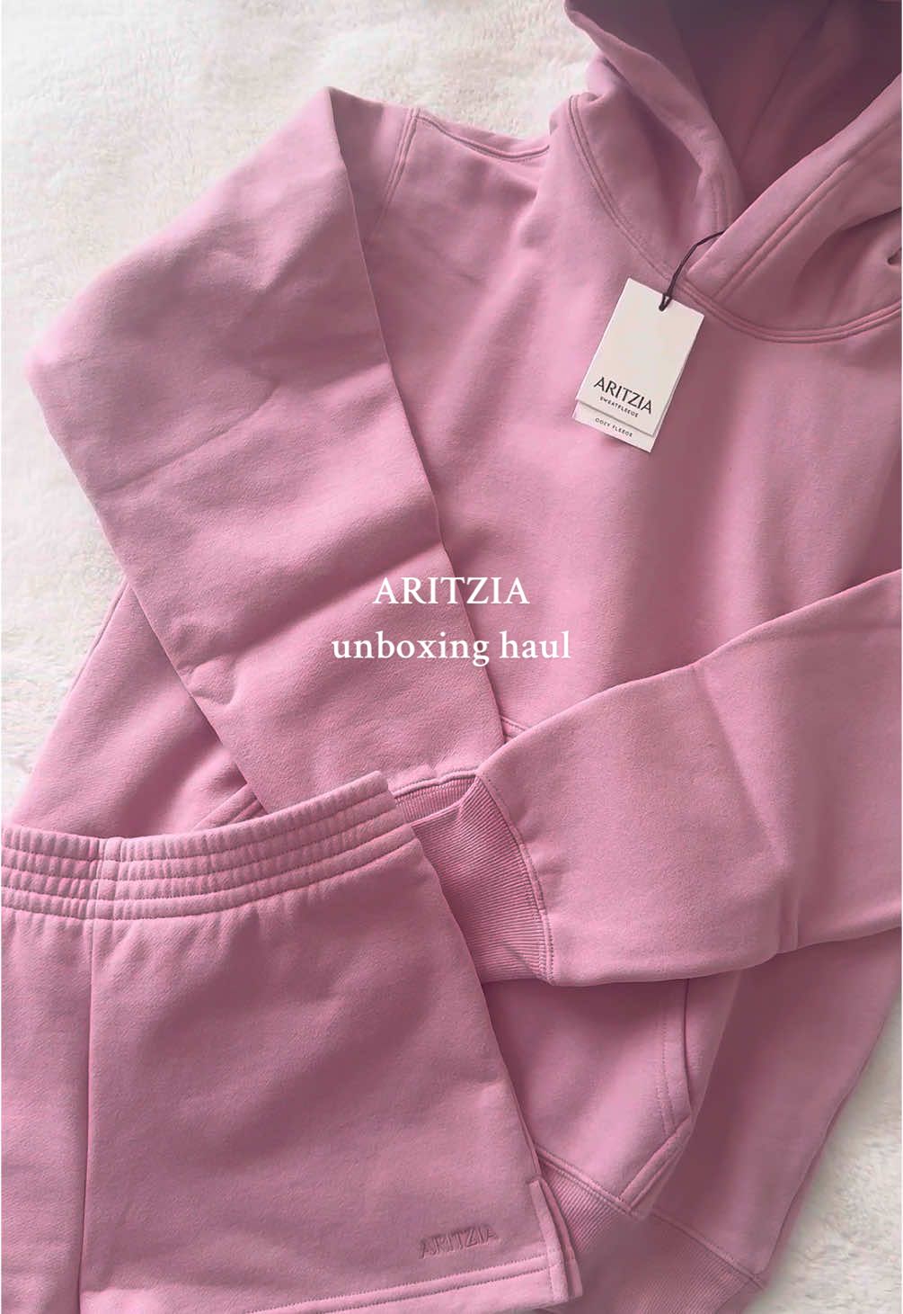 TikTok post by @juliaelizaisi for Aritzia. Caption reads: THE CUTEST NEW COLOUR haven’t made an unboxing....