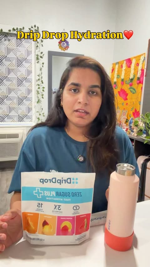 Instagram post by @__varshini._.sri for DripDrop. Caption reads: [...] Keeping my hydration levels up with DripDrop....
