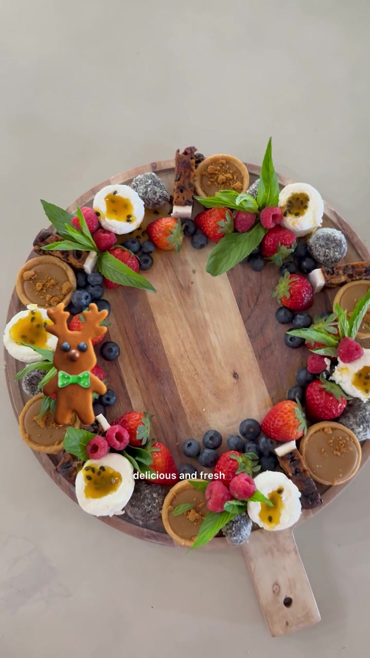 TikTok post by @valareecris for Woolworths. Caption reads: Dessert wreath sorted thanks to @Woolworths_au....