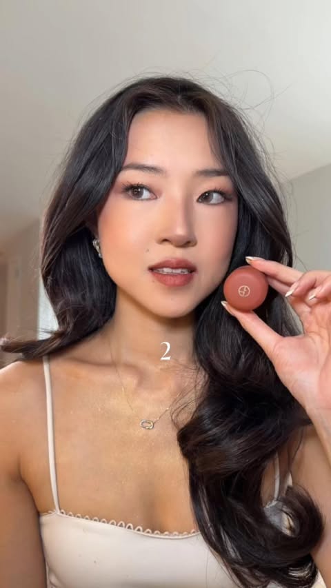 Instagram post by @juliiannalee for Giorgio Armani. Caption reads: [...] suits me best? 💗 @armanibeauty....