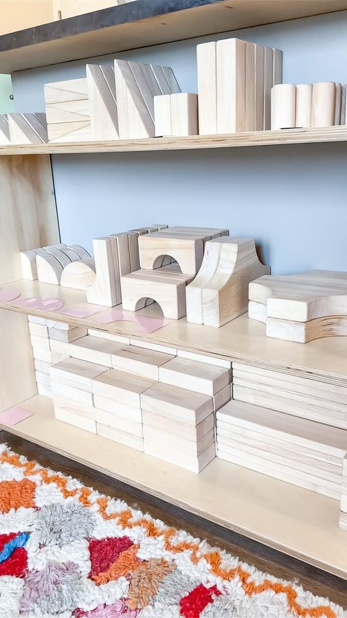 Instagram post by @a.calm.mom for Guidecraft. Caption reads: ⬇️ ⬇️ One more big reason why I think unit blocks....