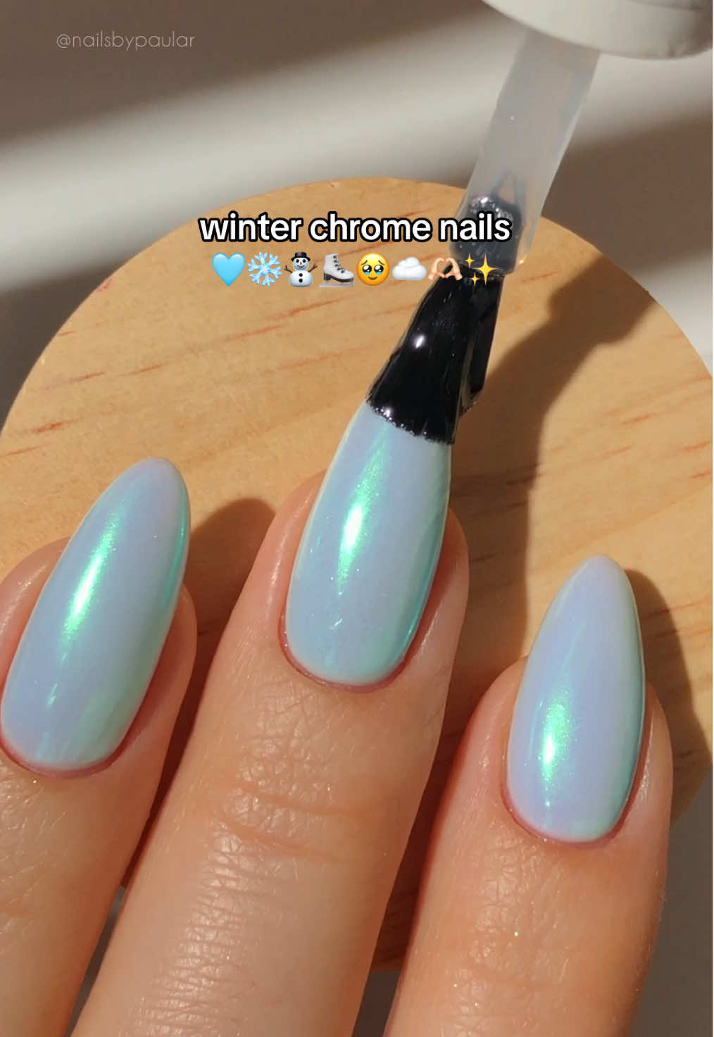 TikTok post by @nailsbypaular for MelodySusie. Caption reads: winter chrome nails! 🩵❄️⛸️ a gorgeous chrome &....