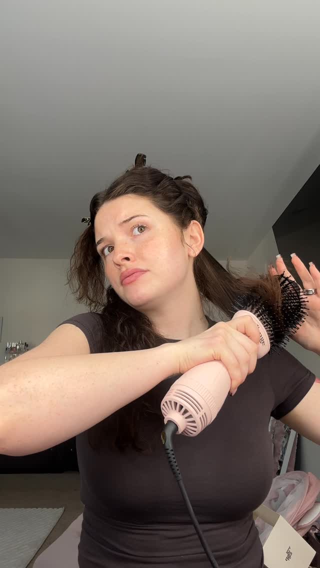 Instagram post by @jadeamberrrr for L'ange Hair. Caption reads: attempting a blowout with a newborn is not for the....