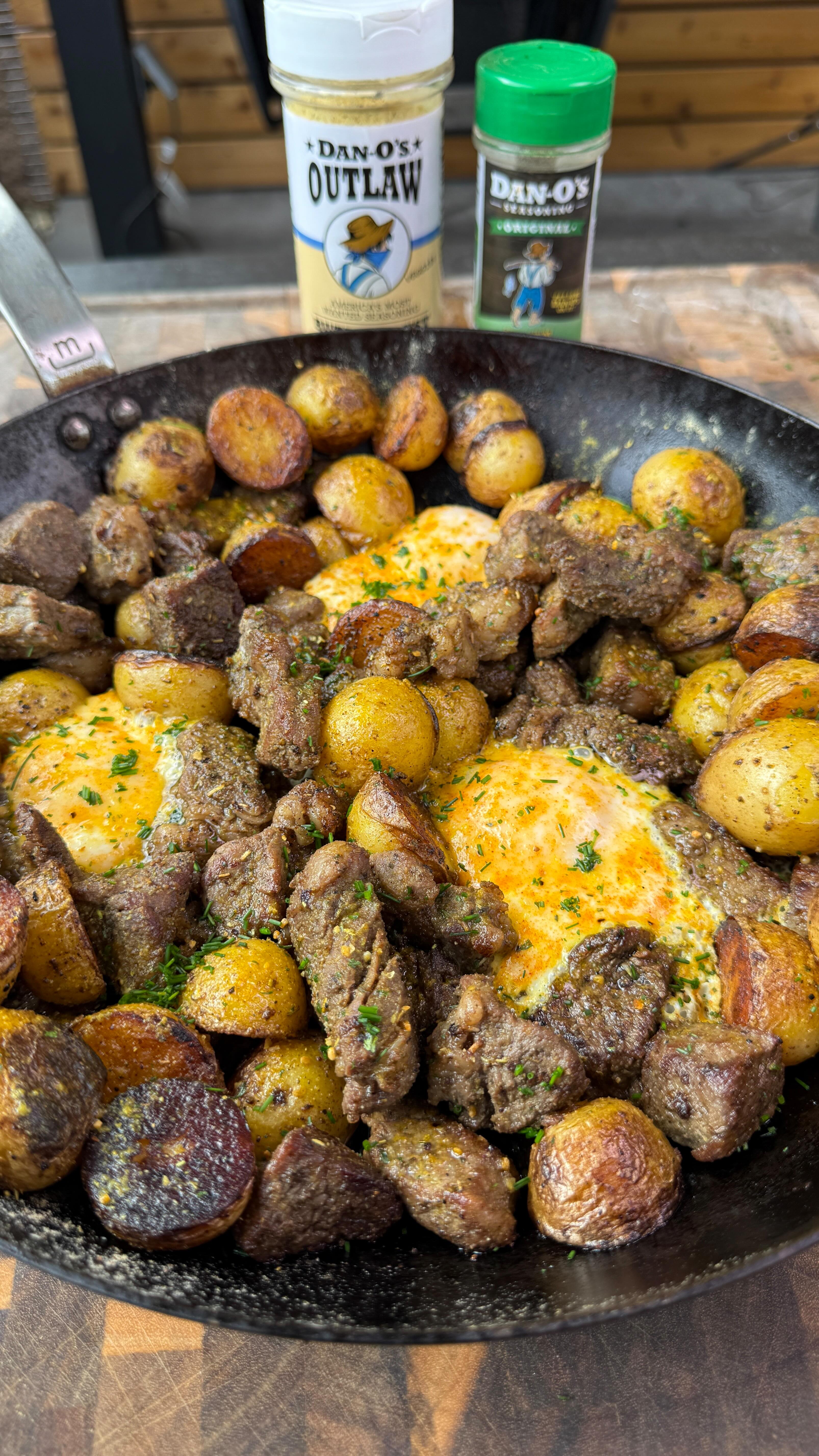 Instagram post by @cooking_with_fire___ for Dan-O's Seasoning. Caption reads: Steak eggs and roasted potatoes with....