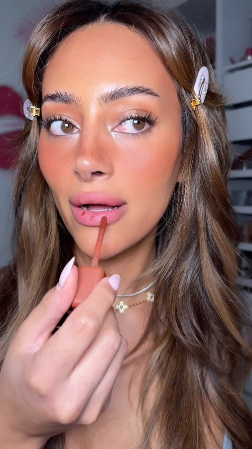 Instagram post by @xoxoemira for About-face Beauty. Caption reads: [...] the biggest trend this spring…🫦😤....