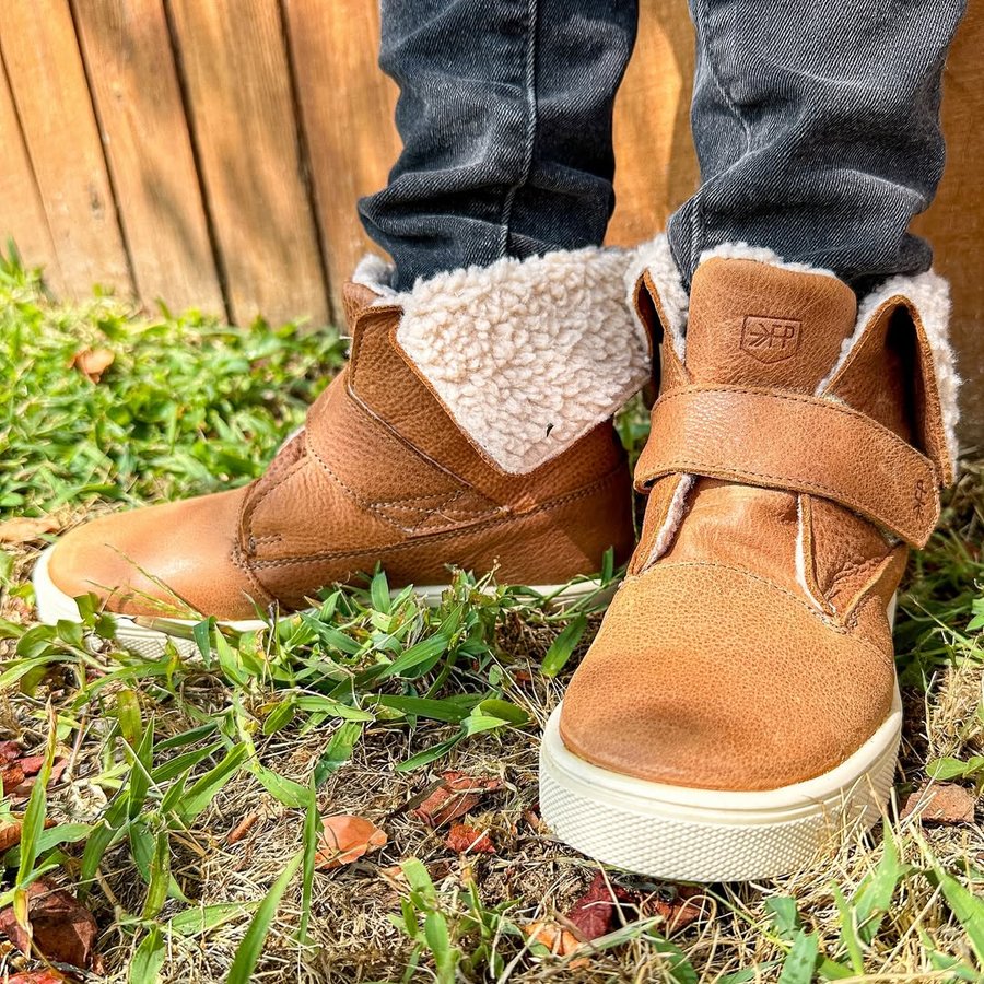 Instagram post by @the.mom.journal for Freshly Picked. Caption reads: [...] He was sent these shoes to try from....