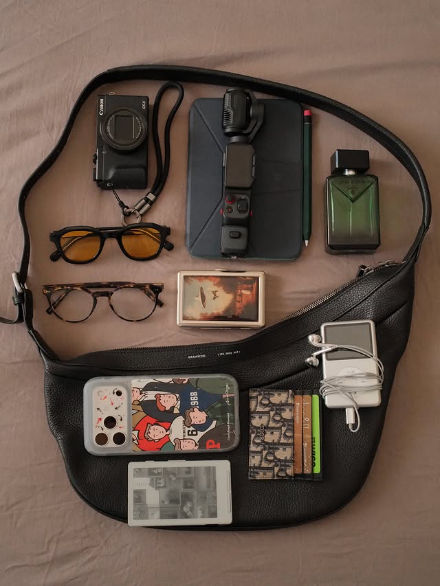 Instagram post by @efekanerg for Warby Parker. Caption reads: what’s in my bag #aesthetic #essentials....
