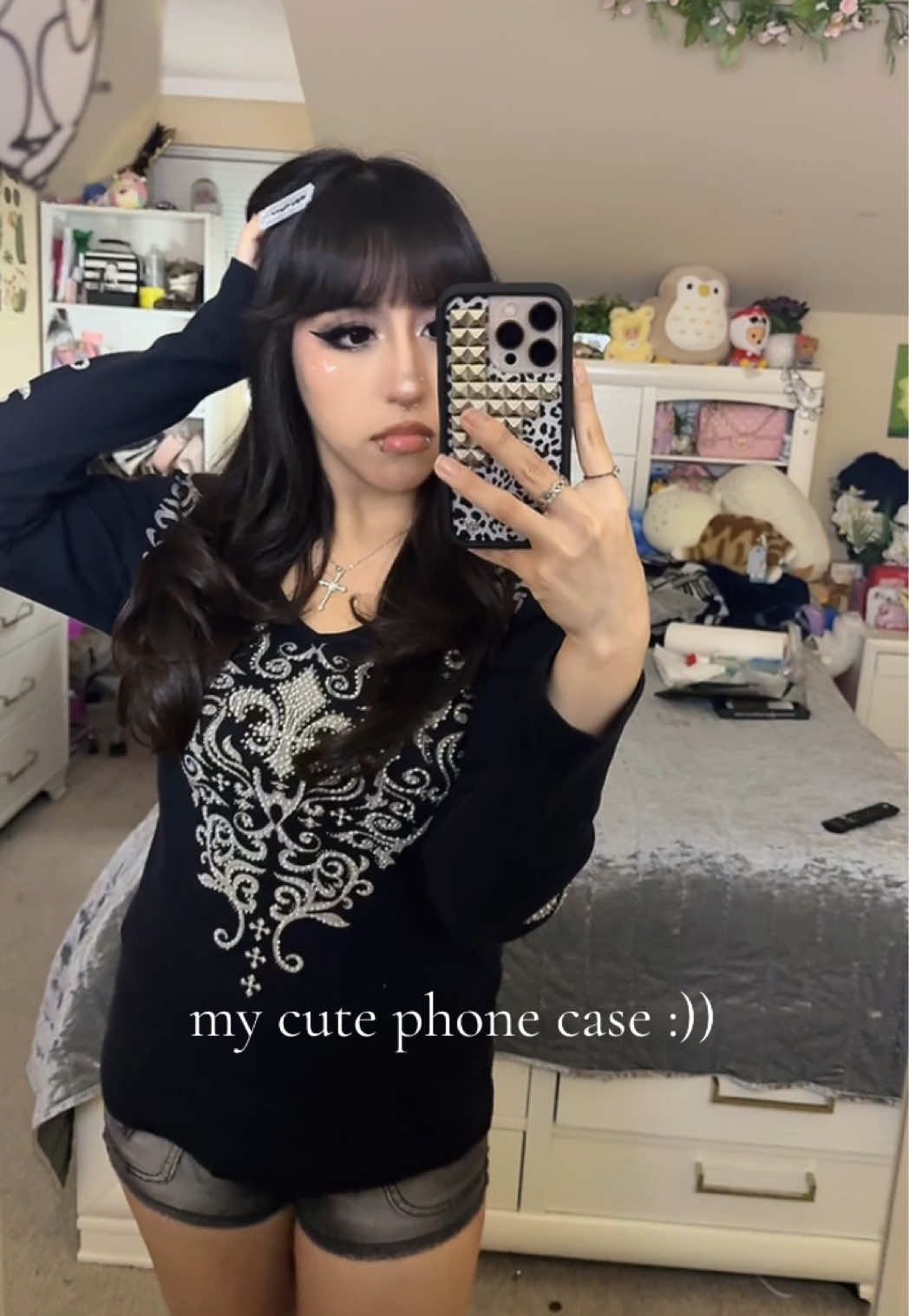 TikTok post by @wrld2del for Wildflower Cases. Caption reads: [...] my outfit so well what the fart <3....