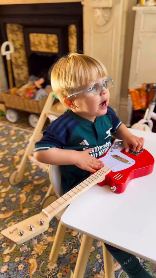 Instagram post by @car.escobar for Loog Guitars. Caption reads: [...] to get Ollie into music, so when....