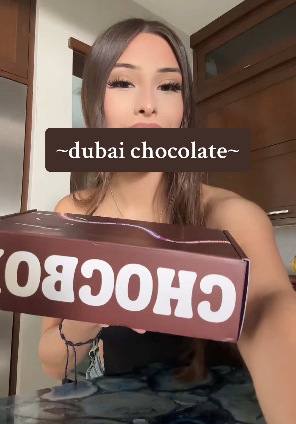 TikTok post by @audreydelucas for Bomb Cosmetics UAE. Caption reads: bomb.comm go get it 😝 #4u #parati #dubaichocolate....