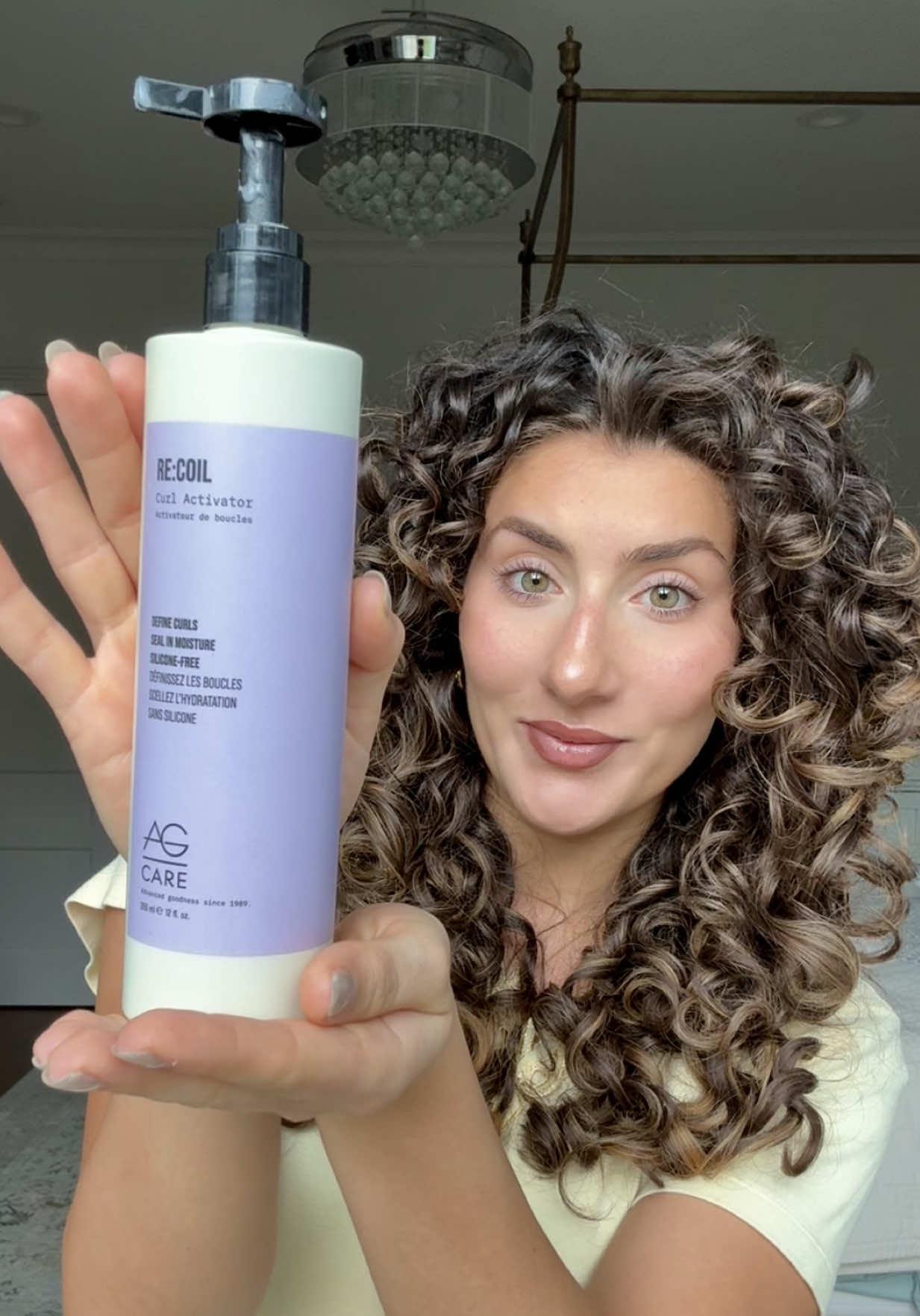 TikTok post by @zainabbnasser for Israel Police (Arabic). Caption reads: Recoil is my most reliable curl cream, it has....