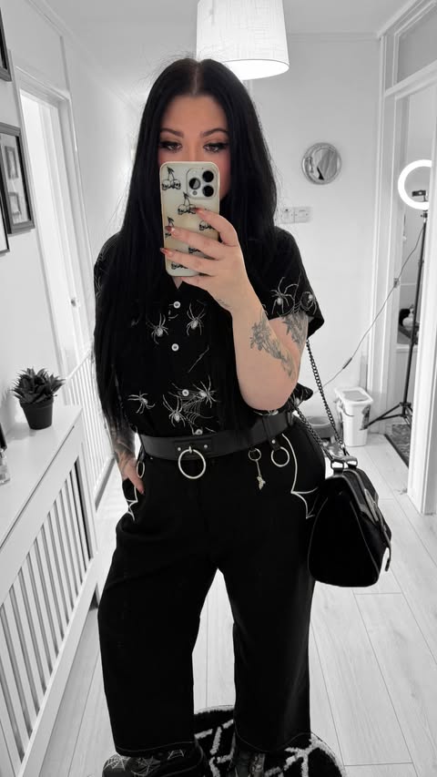 Instagram post by @beautevil.corpse for Hell Bunny. Caption reads: [...] 🕸️ 🕷️ • • Trousers* + Shirt*....