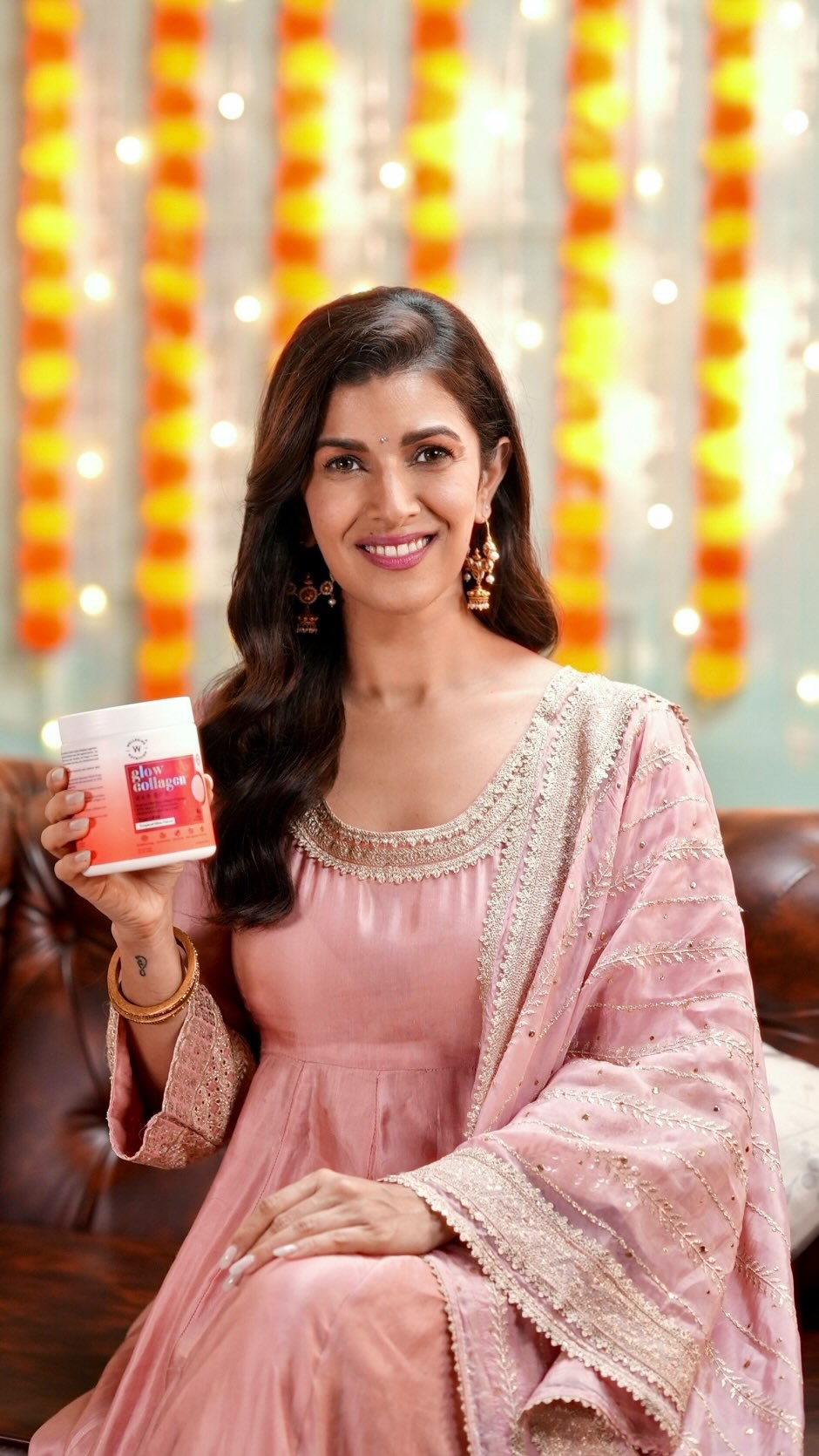 Instagram post by @nimratofficial for Wellbeing Nutrition. Caption reads: Behind every ‘you’re glowing!’ compliment I get is....