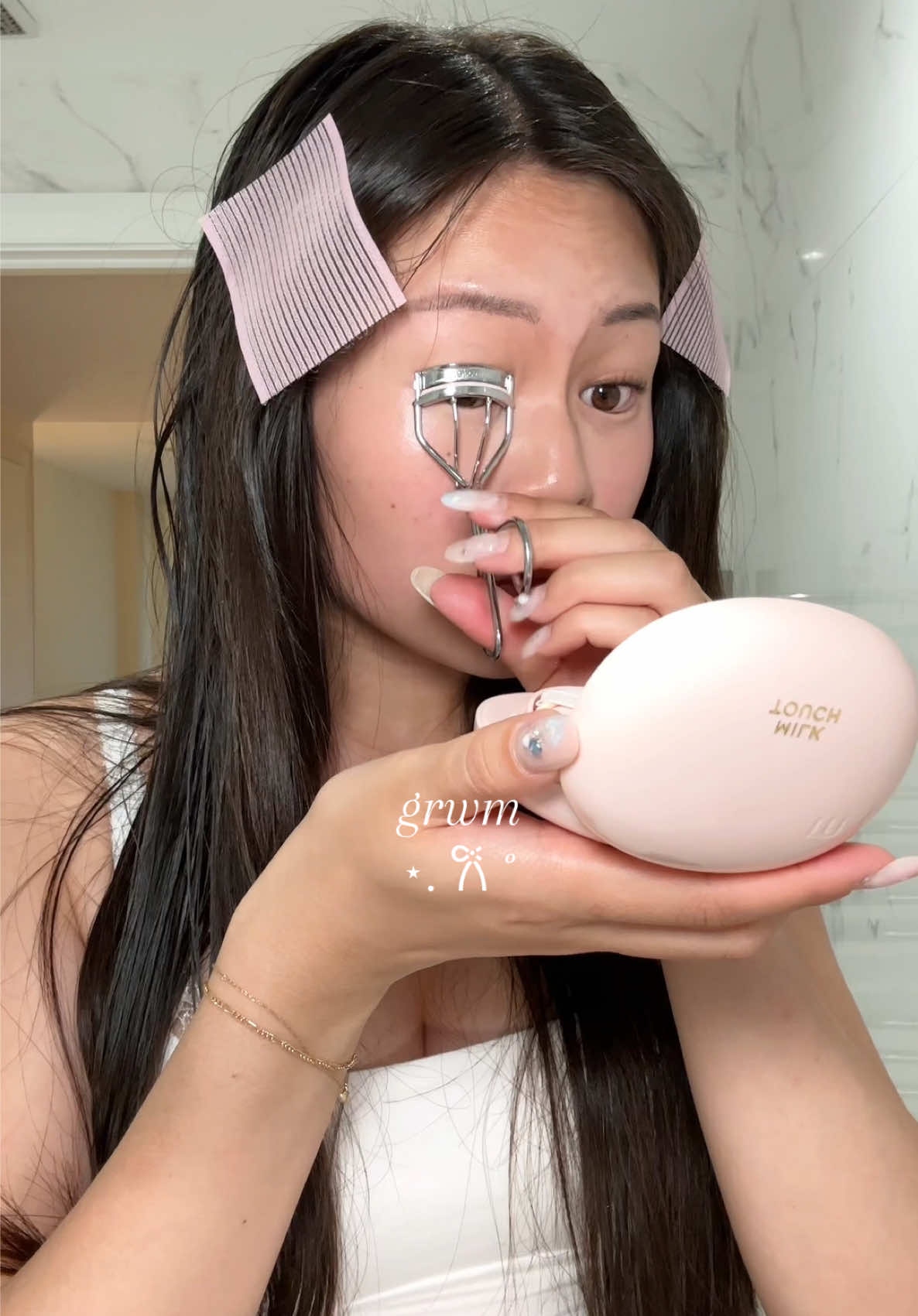 TikTok post by @olafflee for Glossier. Caption reads: [...] multi stick (tenderly) @Glossier powder....