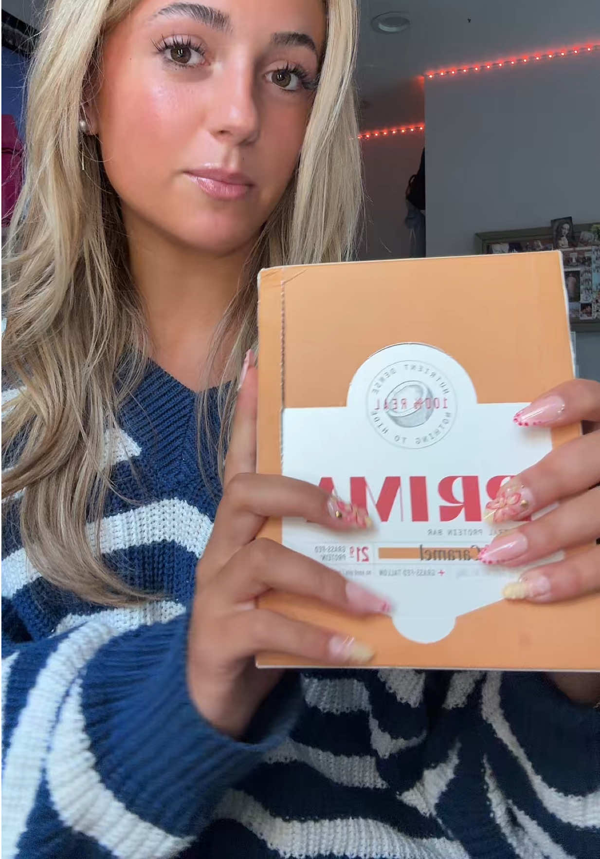 TikTok post by @gracepeluso_ for PRIMA Ancestral Protein Bar. Caption reads: trying out @PRIMA Ancestral Protein Bar !! #prima....