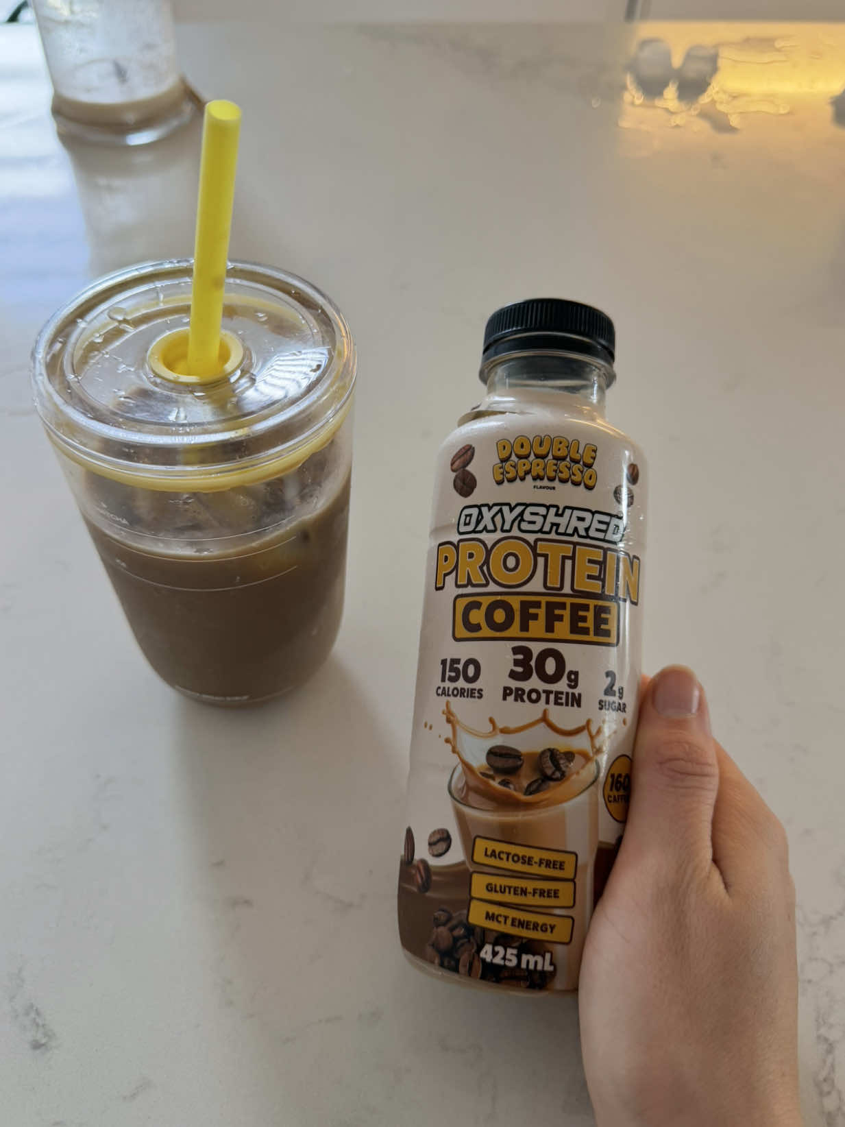TikTok post by @ellieebostockk for OxyShred Energy. Caption reads: [...] morning iced latte…. say no more 👀....