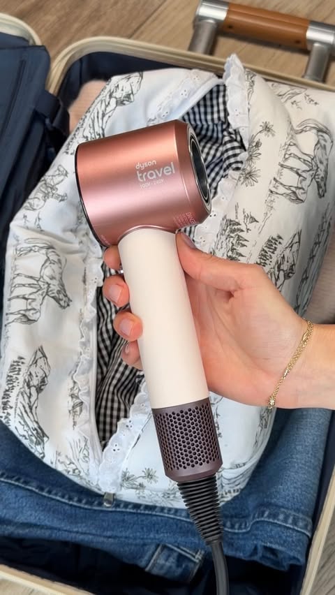 Instagram post by @zhanna.red for Dyson Beauty. Caption reads: now boarding: the new @dysonbeauty Supersonic™....