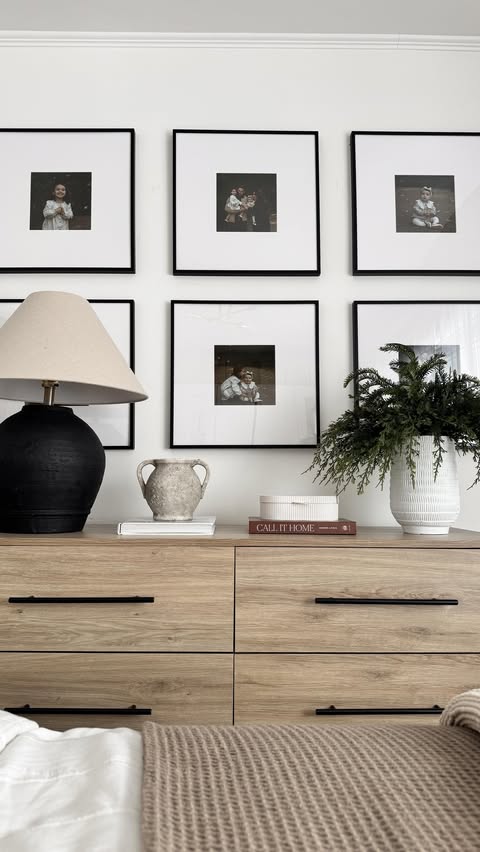 Instagram post by @inspiredbyclaudia for Frame It Easy. Caption reads: This gallery wall from @frameiteasy has completely....