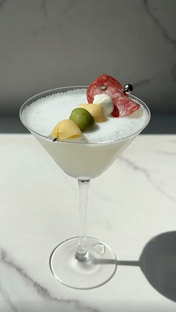 Instagram post by @thethirstygals for Banza. Caption reads: [...] Water Proteini ~ 2.5 oz gin 2 oz @eatbanza....